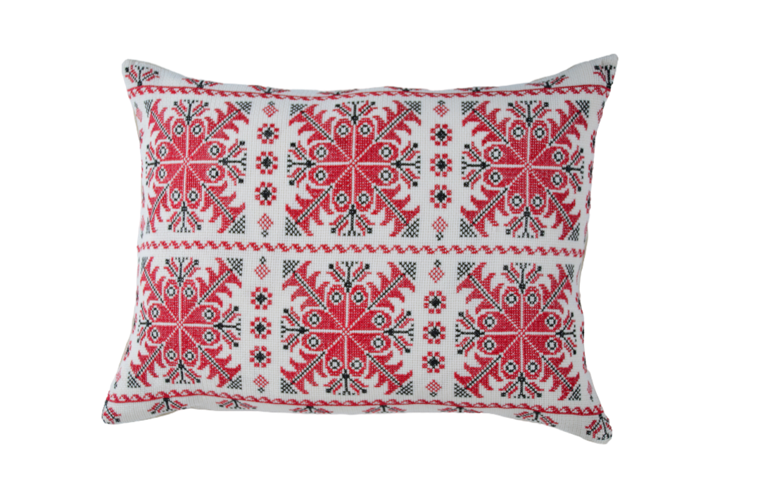 Embroidered handwoven antique Hungarian hemp pillow with red and blue patterns.
