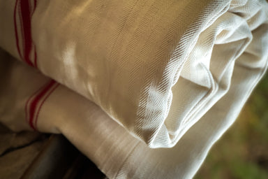 Antique handwoven Hungarian grain sack bedroll with cotton fill.