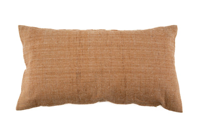 Handwoven organic cotton pillow with natural plant dye.