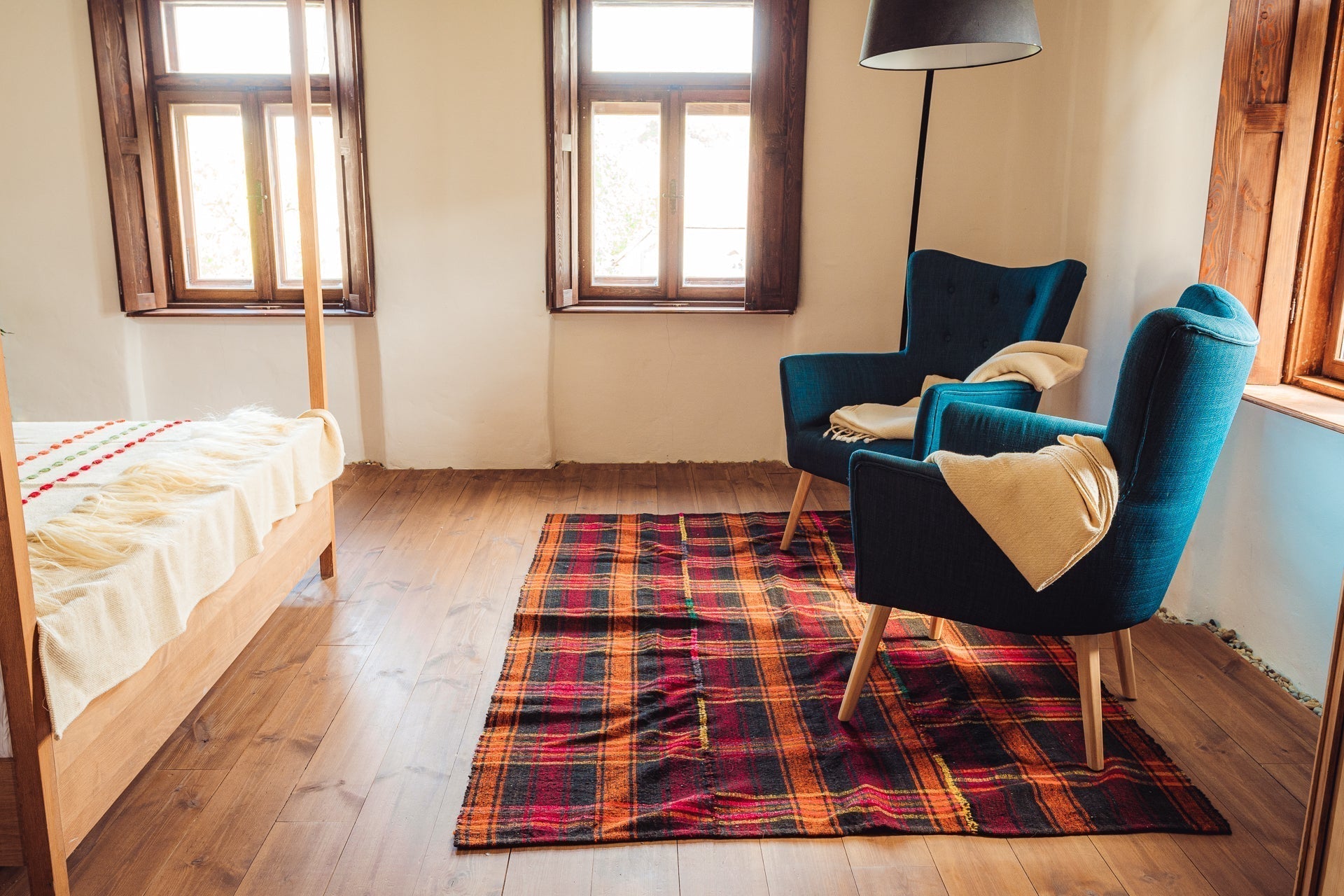 Antique handwoven Bulgarian rug, stripe wool pattern, 210x260 cm, on wooden floor.