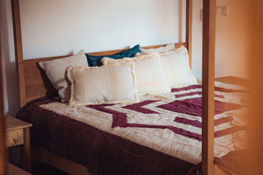 Organic handwoven hemp bed cover quilt with diamond appliqué, featuring antique textiles from Hungary and Bulgaria.