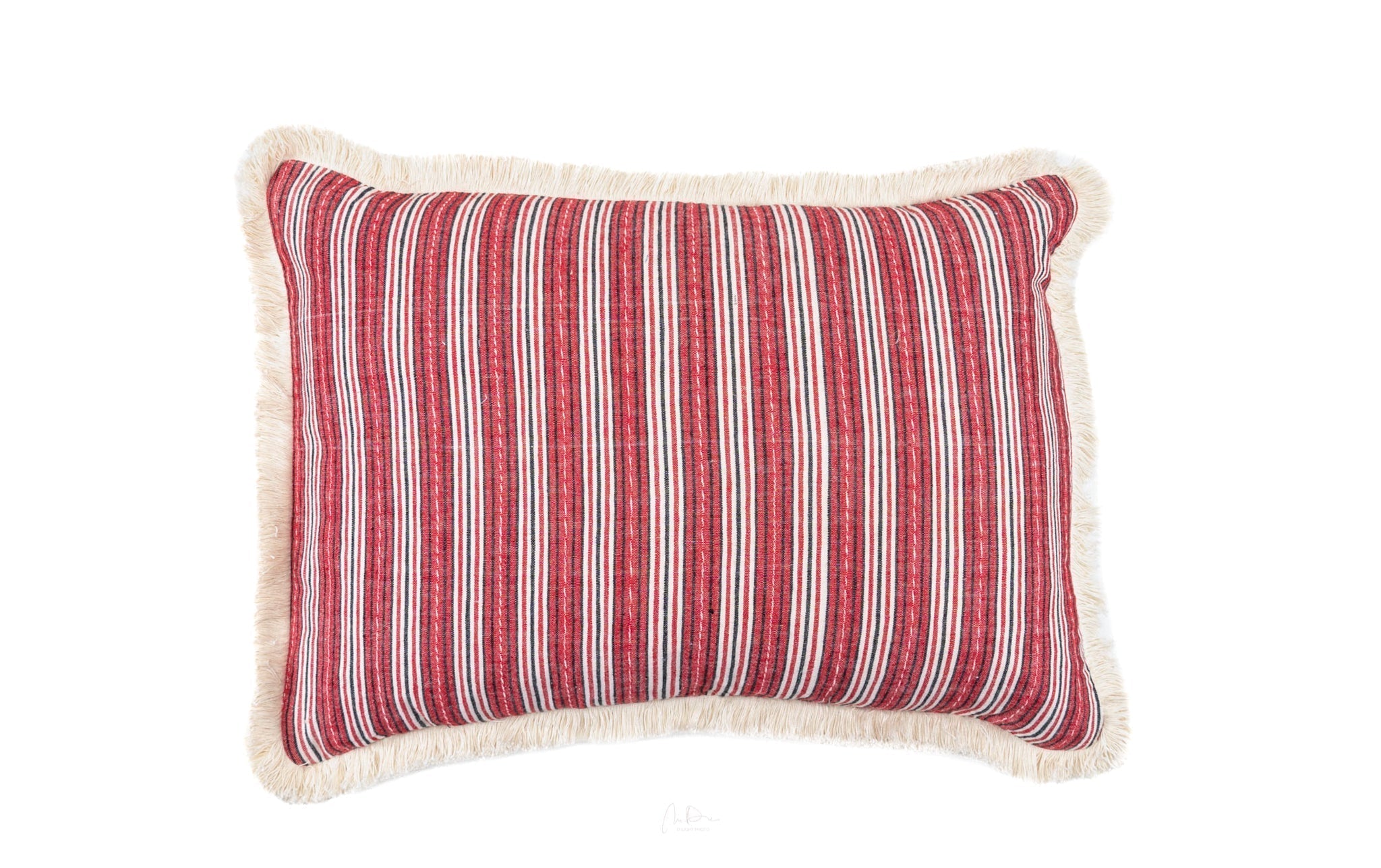 Handwoven antique Hungarian hemp pillow with red and white stripes, fringed edges.