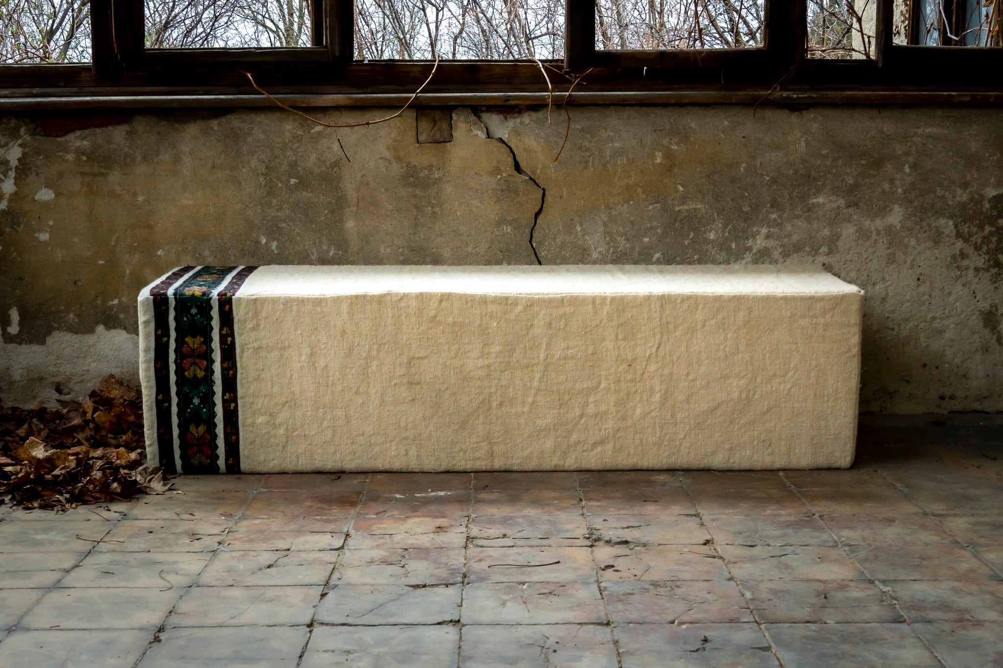 Antique Hungarian handwoven hemp ottoman with decorative border, rare artisanal piece.