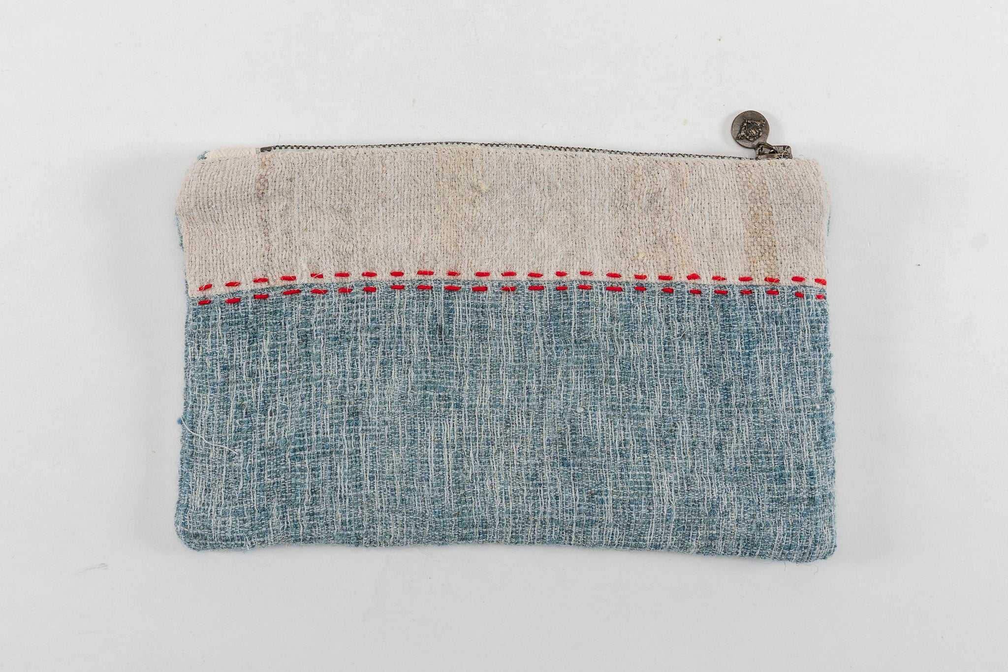 Handwoven wool bag with handwoven hemp lining and metal zipper.