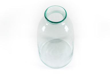 Handblown glass vintage vase in pale aqua, ideal for centerpiece or accent arrangements.