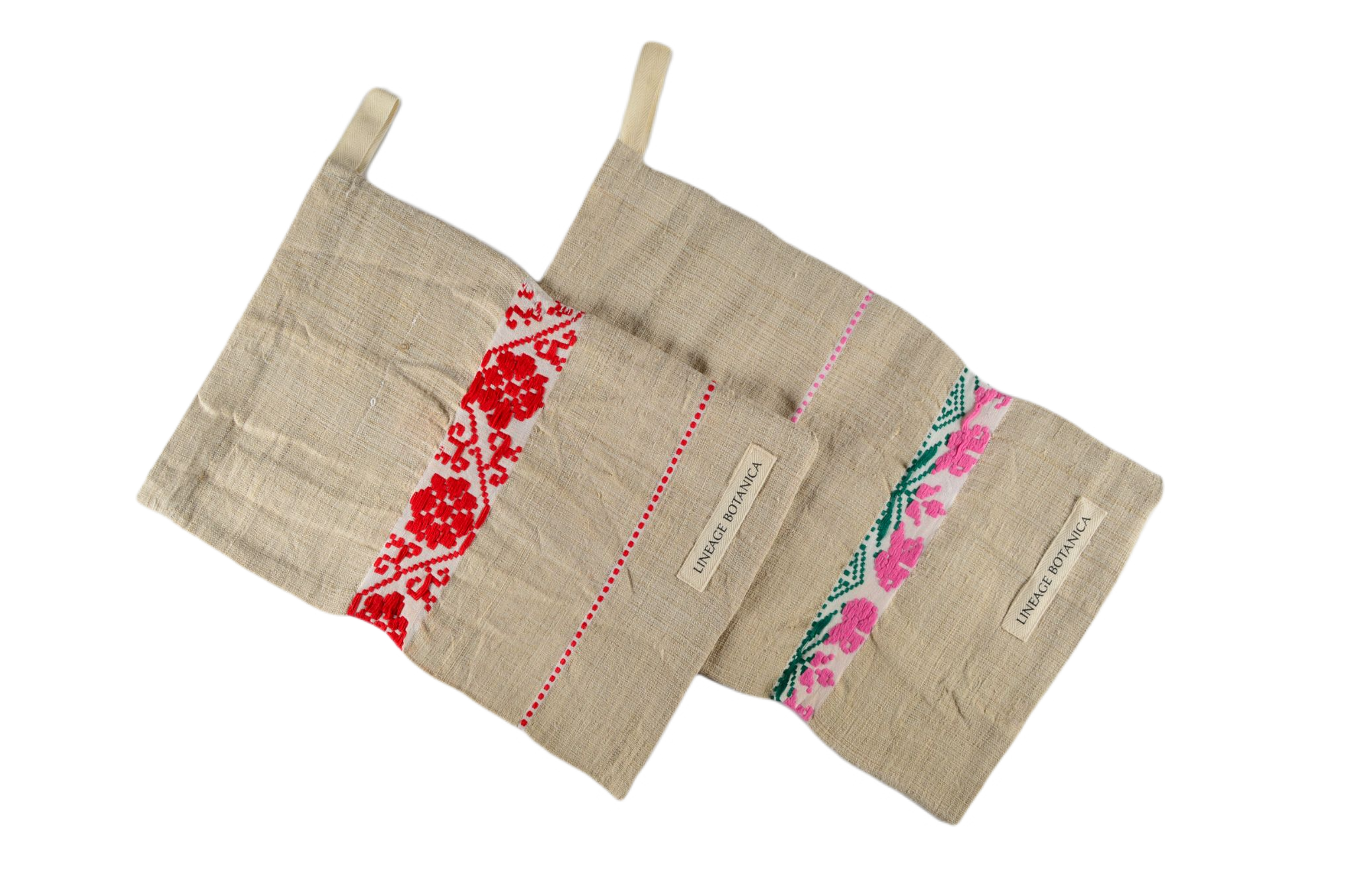 Handwoven antique hemp bread bags with colorful embroidery.