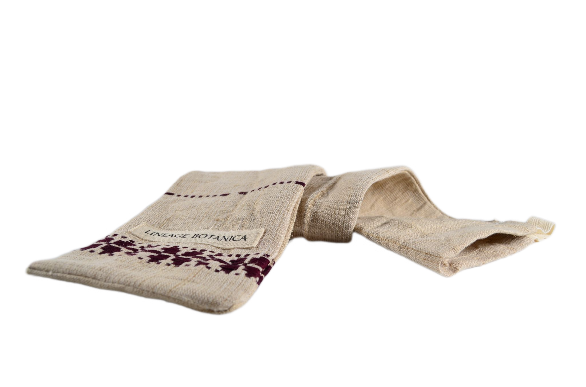 Handwoven antique hemp baguette bag with unique embroidery patterns.