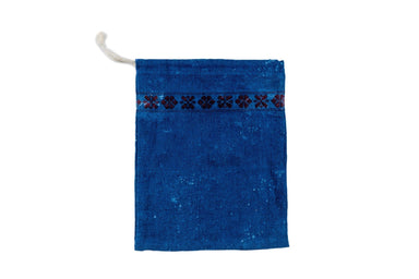 Handwoven antique bread bag in indigo with floral pattern, made from vintage textiles and hemp.