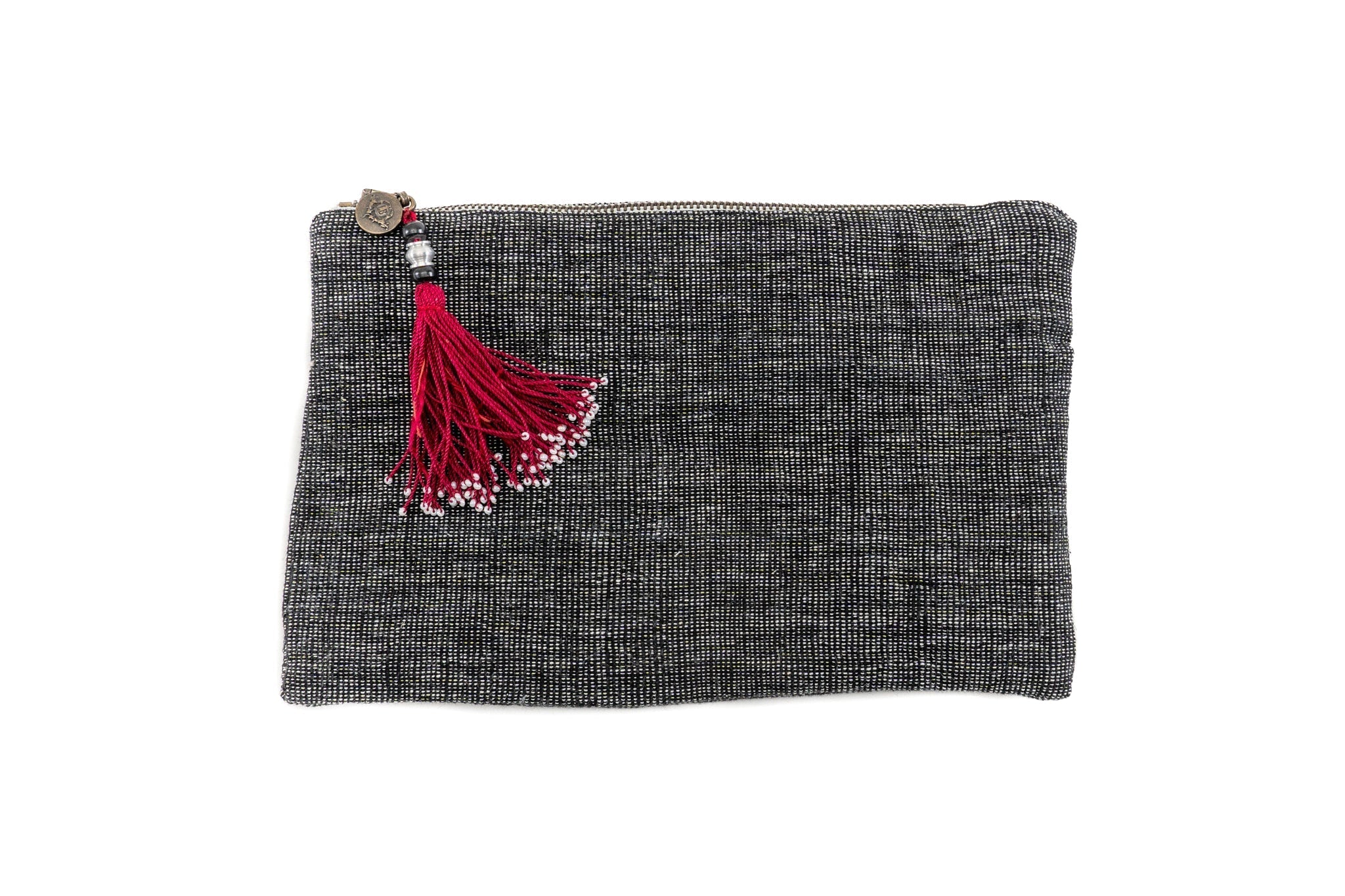 Handwoven antique cotton and hemp bag with red tassel, versatile zippered pouch.