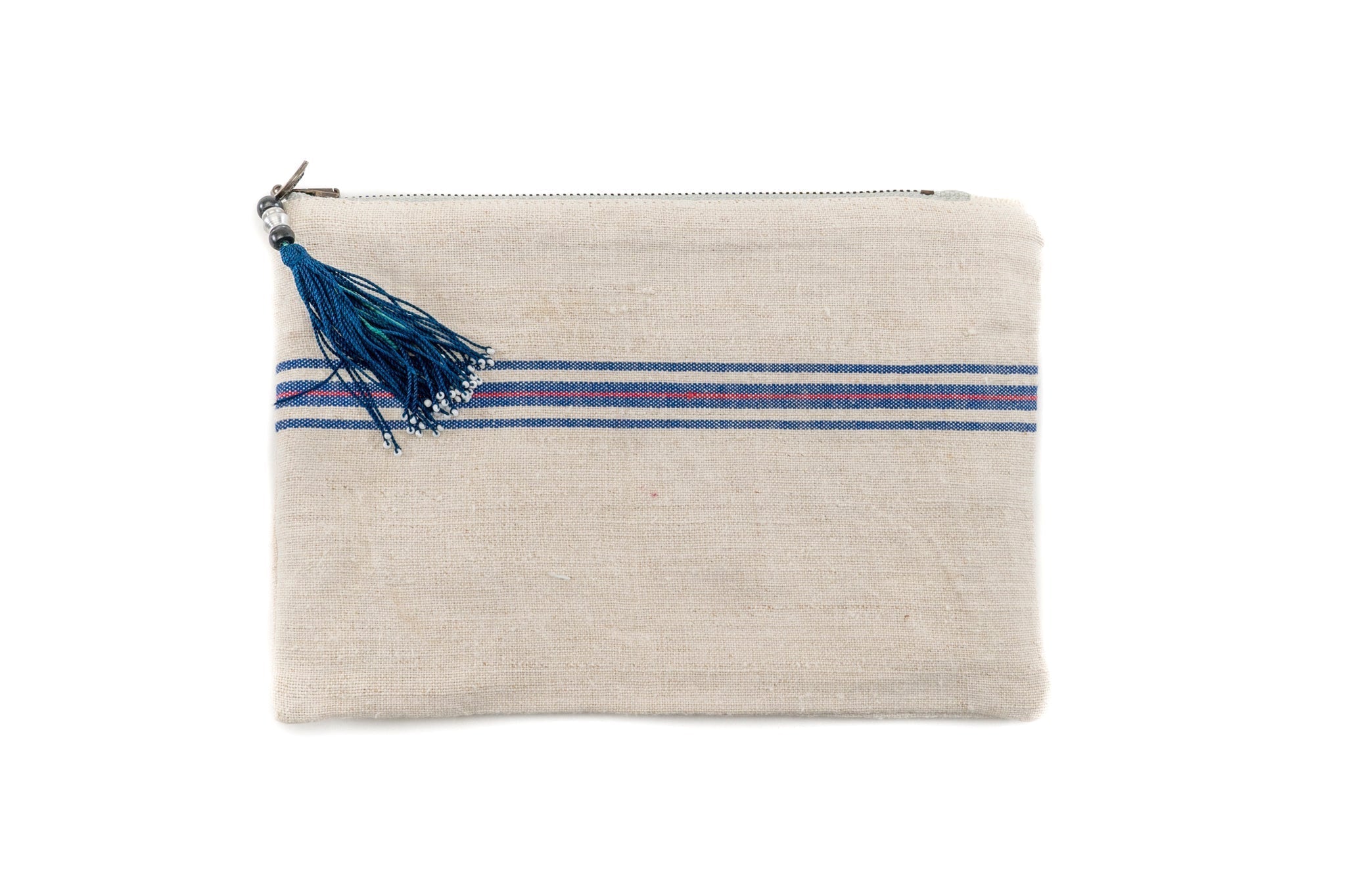 Handwoven antique hemp bag with blue tassel and zipper, vintage textile design.