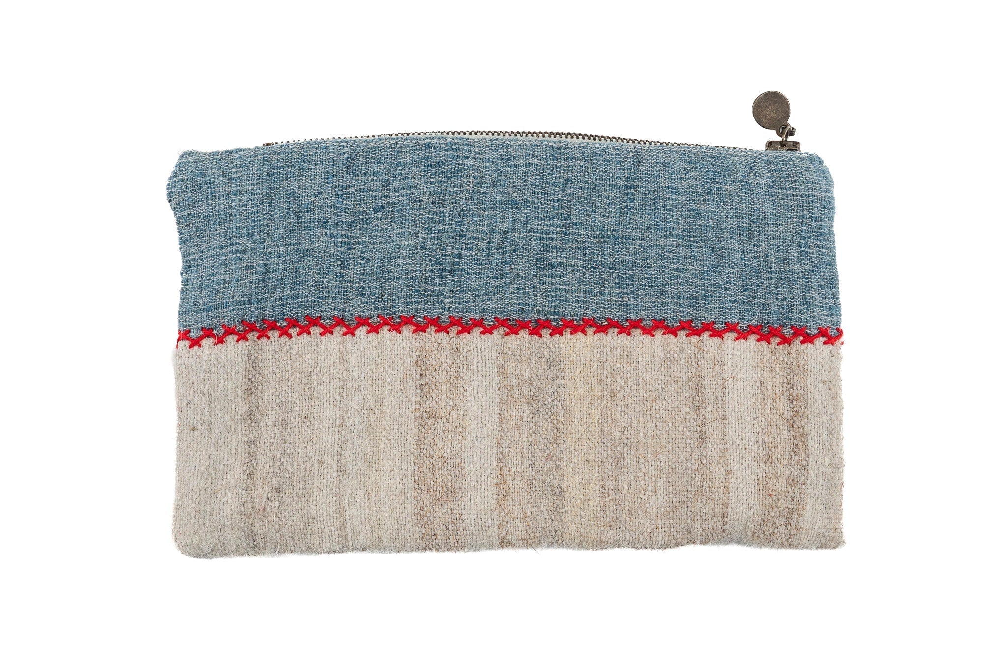 Handwoven wool bag with antique hemp lining, featuring natural dyes and a metal zipper.