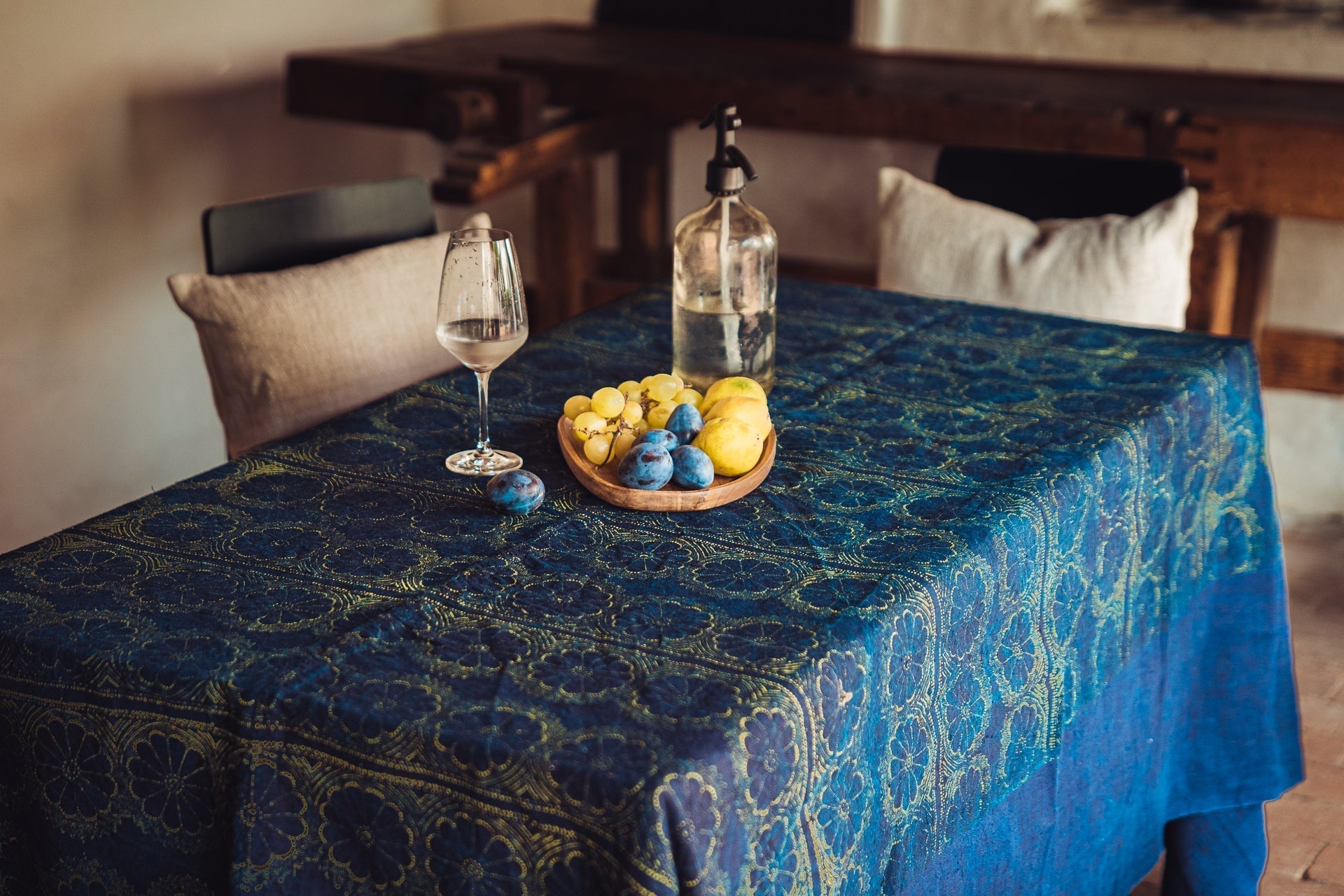 Antique handwoven Hungarian hemp table cloth with wax resist indigo dye, yellow border pattern.