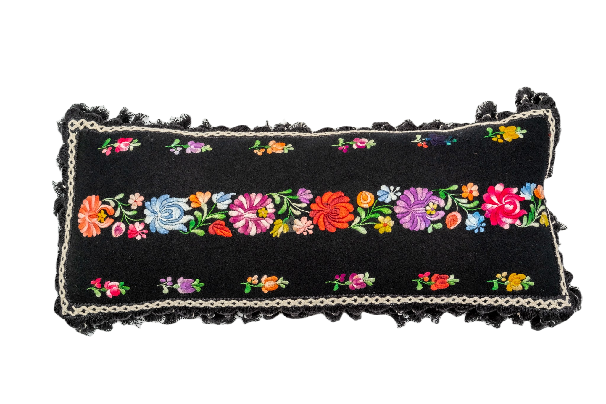 Embroidered handwoven antique Hungarian hemp pillow with floral design and cotton fringe.
