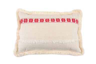 Handwoven antique Hungarian hemp pillow with red carnation pattern and cotton fringe.