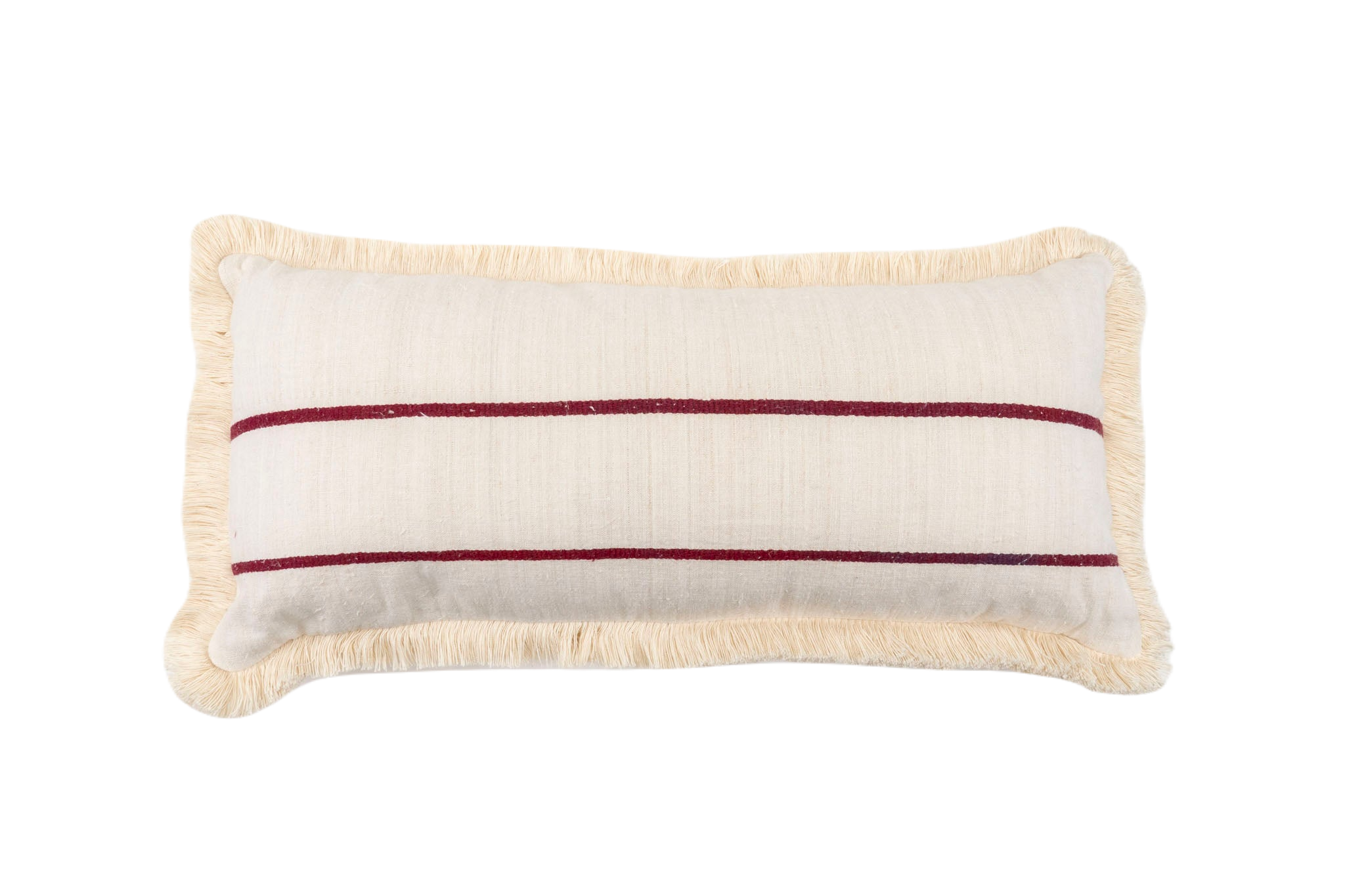 Antique handwoven decorative pillow with intricate patterns and fringe detailing.