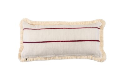 Antique handwoven decorative pillow with vintage design and fringe detailing.