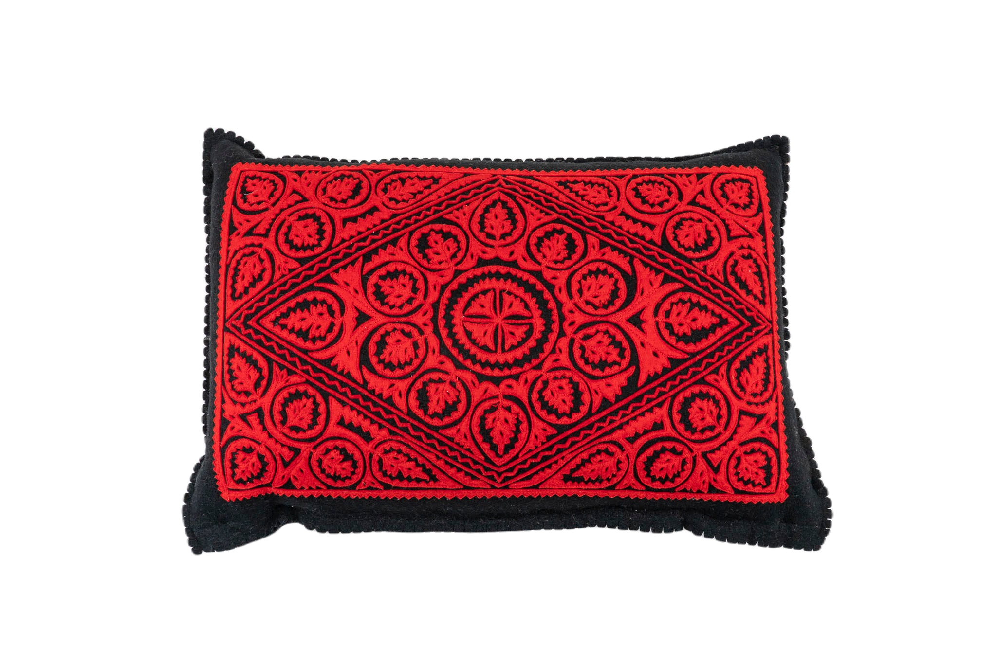 Antique handwoven Hungarian wool pillow with intricate red and black design.