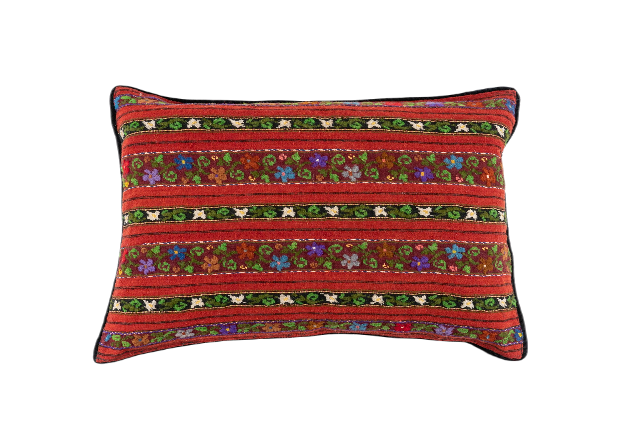 Artifact textile handwoven pillow, Romanian design, with colorful patterns on a red background.
