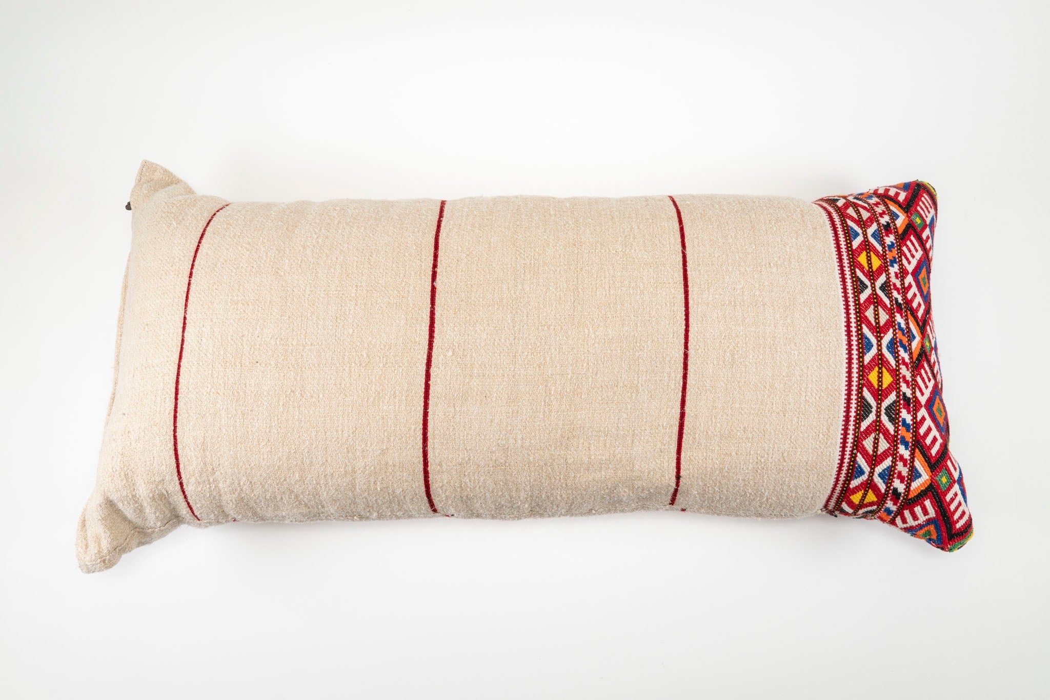 Handwoven antique Hungarian hemp pillow with embroidered edge and recycled goose down insert.