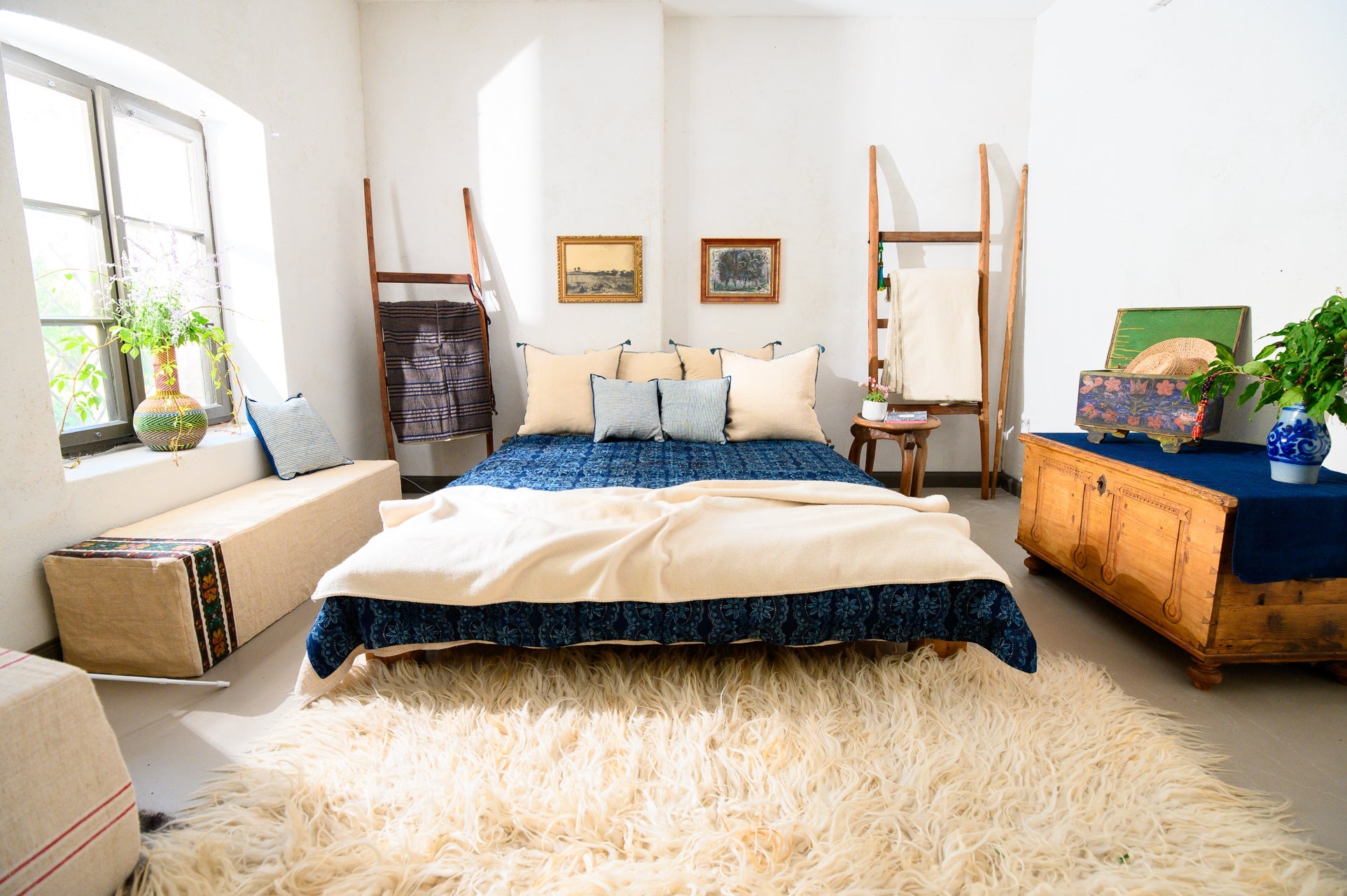 Handwoven antique hemp pillows in cozy bedroom setting with rustic decor.