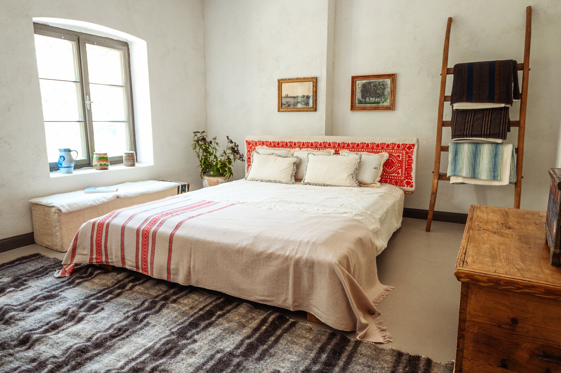 Organic handwoven hemp bed cover in a cozy bedroom setting.