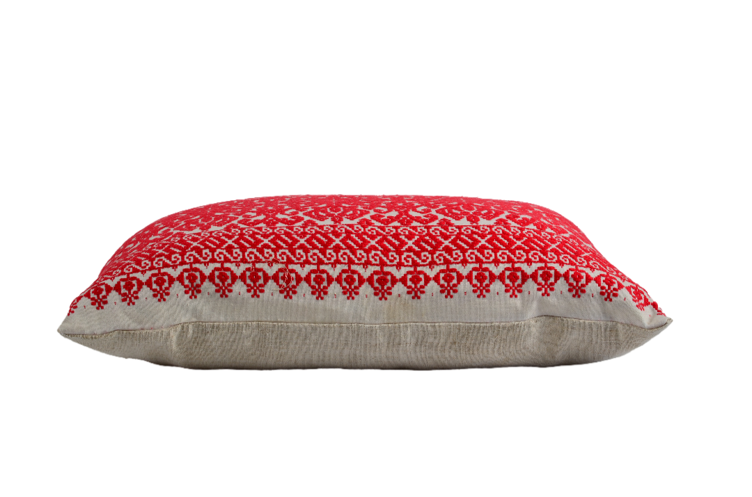 Embroidered handwoven antique Hungarian hemp pillow with red and white pattern.