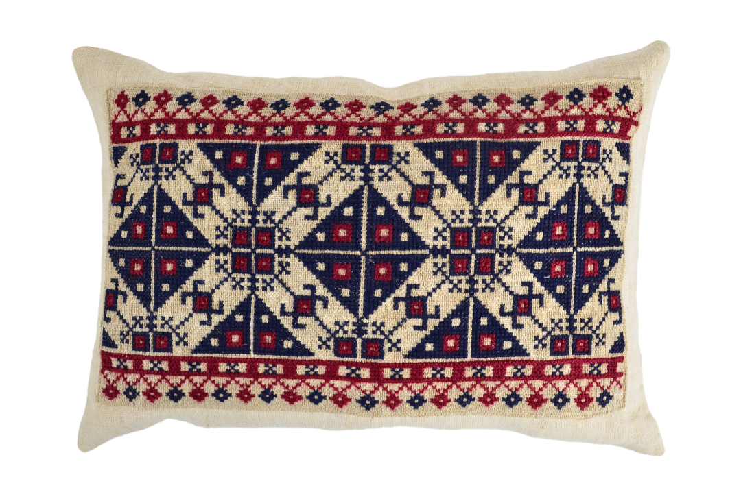 Embroidered handwoven antique Hungarian hemp pillow with intricate patterns.