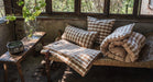 Handwoven organic cotton pillows with natural dye, sustainable home decor.