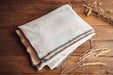 Soft organic eco cotton blanket on wooden surface, perfect for sustainable comfort and style.