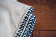 Organic eco-cotton blanket with indigo trim, hand-stitched, artisan made.