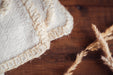 Organic eco-cotton blanket with natural trim, handcrafted and artisan woven.