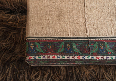 Rare antique Hungarian handwoven hemp cloth ottoman with decorative border.