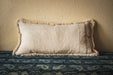 Antique handwoven decorative pillow with cotton fringe, neutral hemp fabric.