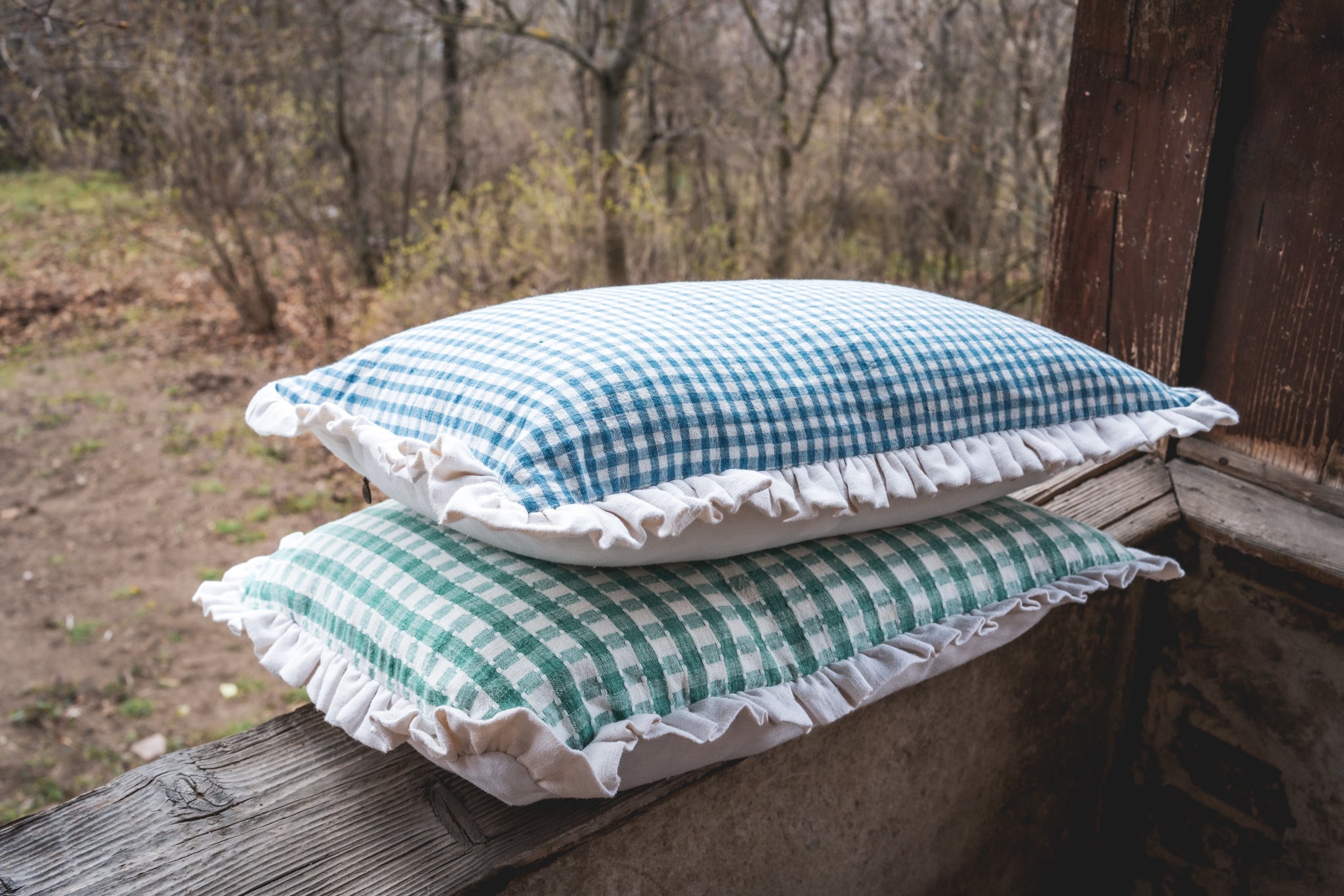 Antique handwoven decorative pillows with Bulgarian cotton and flair, displayed outdoors.