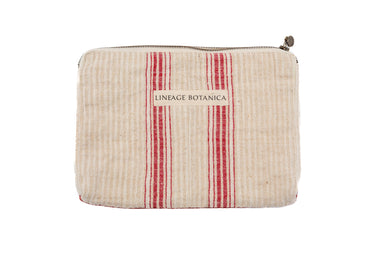 Handwoven antique and vintage cotton and hemp bag with red stripes and zipper.