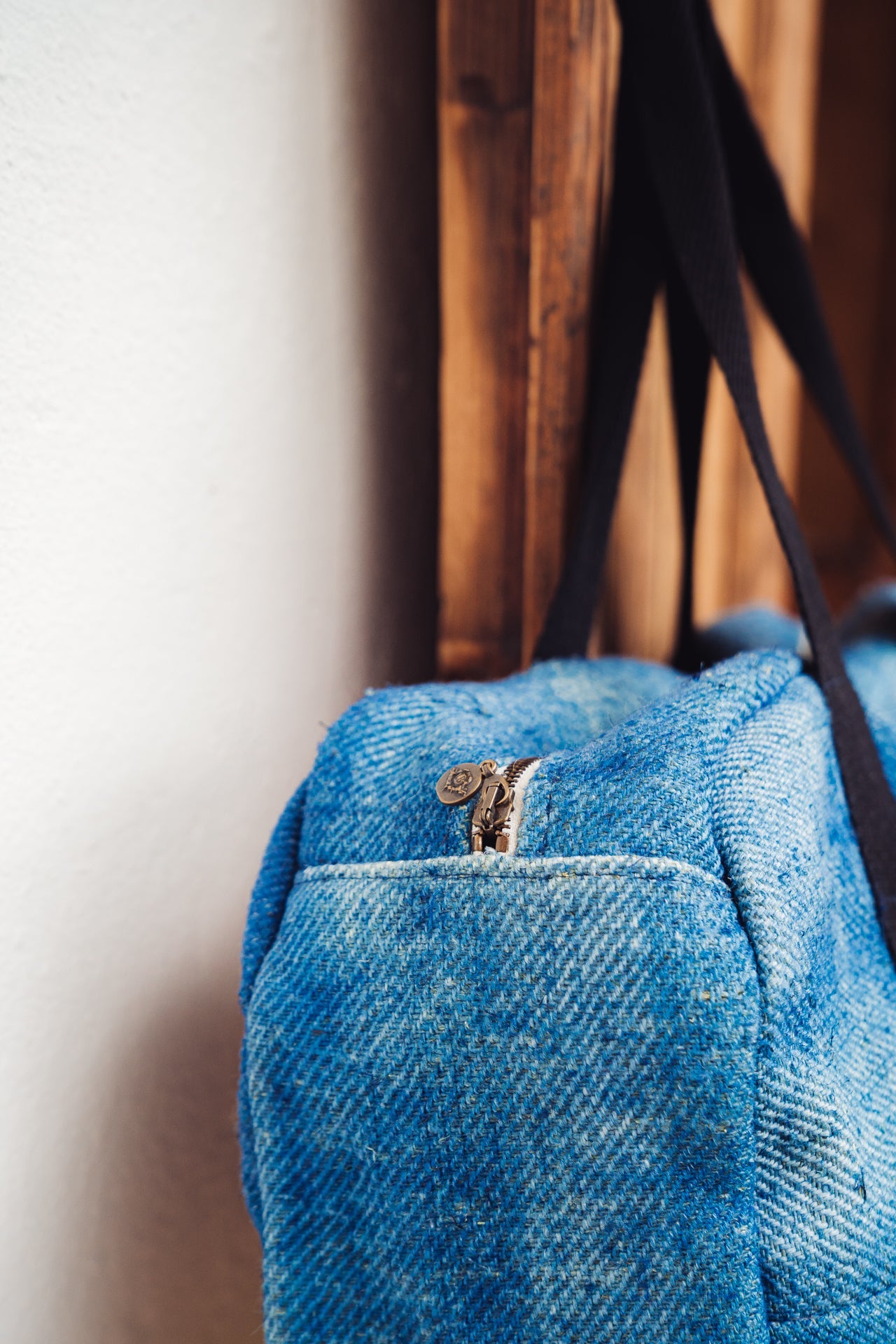 Handwoven hemp bag with indigo hue and cotton straps, made from antique Hungarian grain sack.