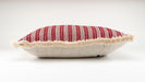 Handwoven antique Hungarian hemp pillow with red striped pattern.