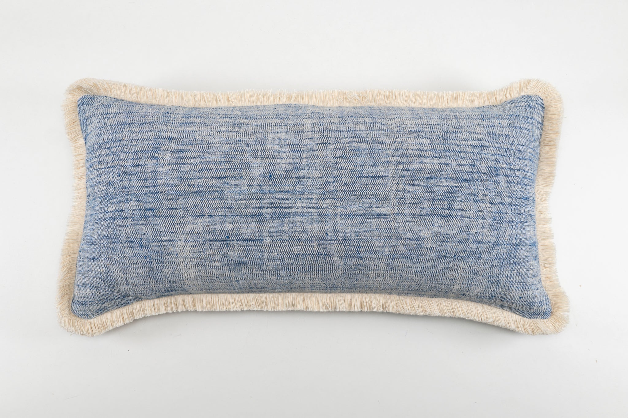 Handwoven antique Hungarian hemp pillow with indigo hemp back and cotton fringe.