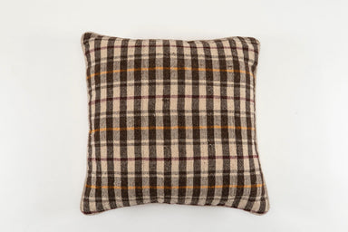 Handwoven antique Bulgarian woolen textile pillow with plaid pattern.