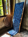 Antique handwoven Hungarian hemp table runner with indigo over dye displayed on a wooden ladder.