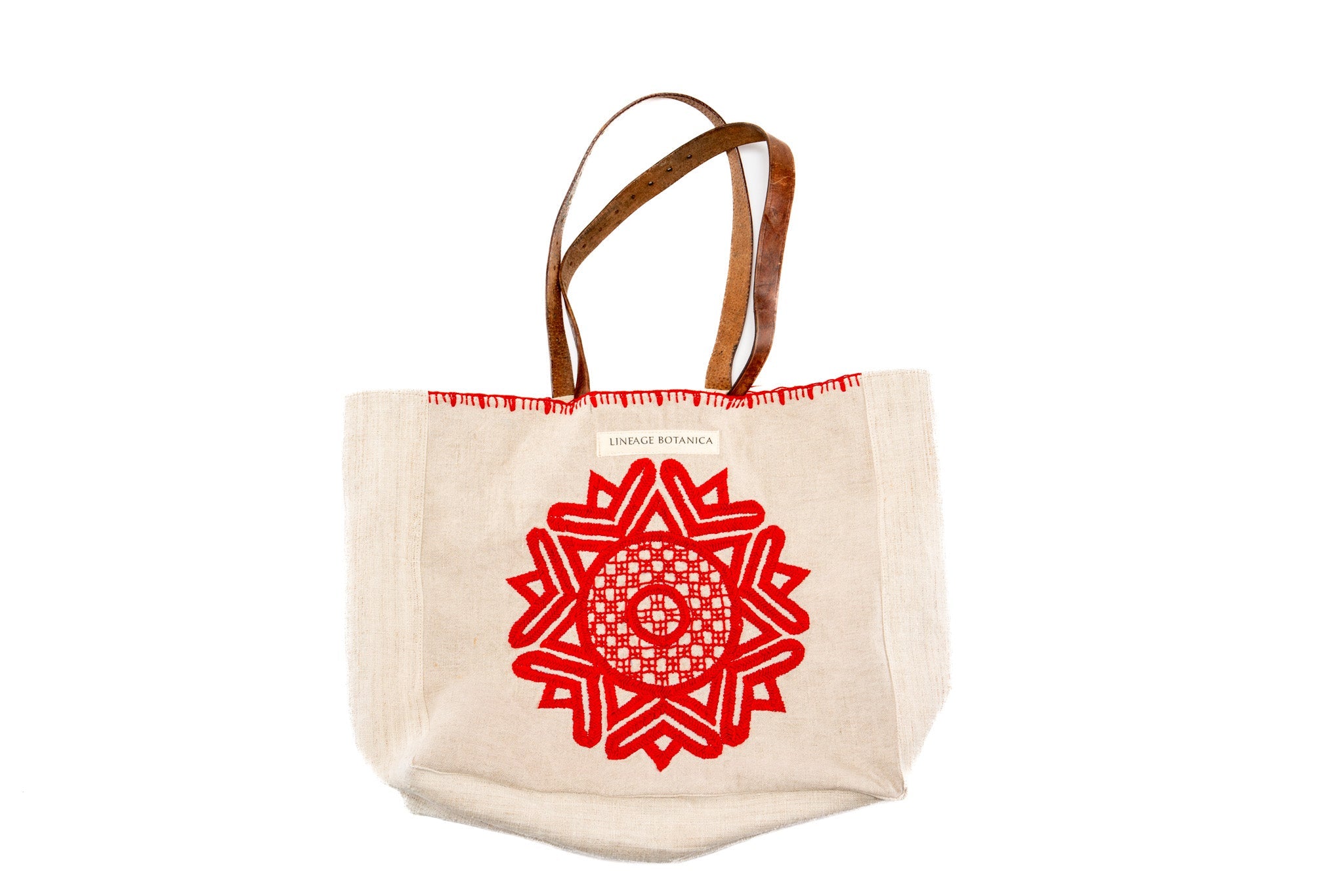 Handwoven antique hemp bag with embroidered Mandala and recycled leather strap.