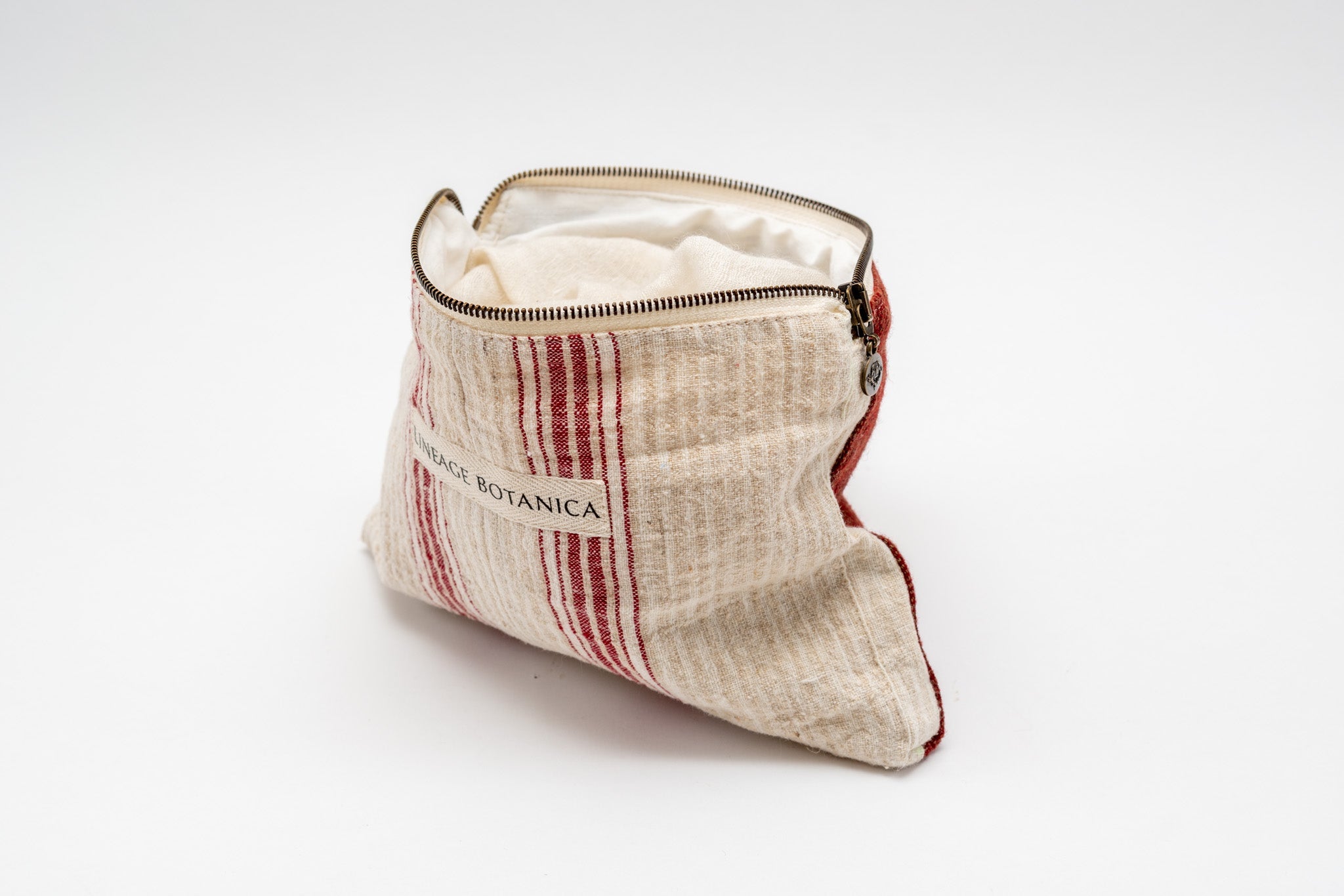 Handwoven antique and vintage cotton and hemp bag with red stripes and zip, made in Hungary.