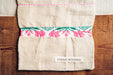 Handwoven antique hemp bread bag with pink and green embroidery.