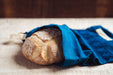 Handwoven antique indigo bread bag with artisan bread.