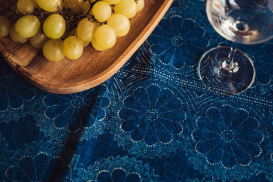 Antique handwoven Hungarian hemp table cloth with indigo dye, featuring grapes and a wine glass.