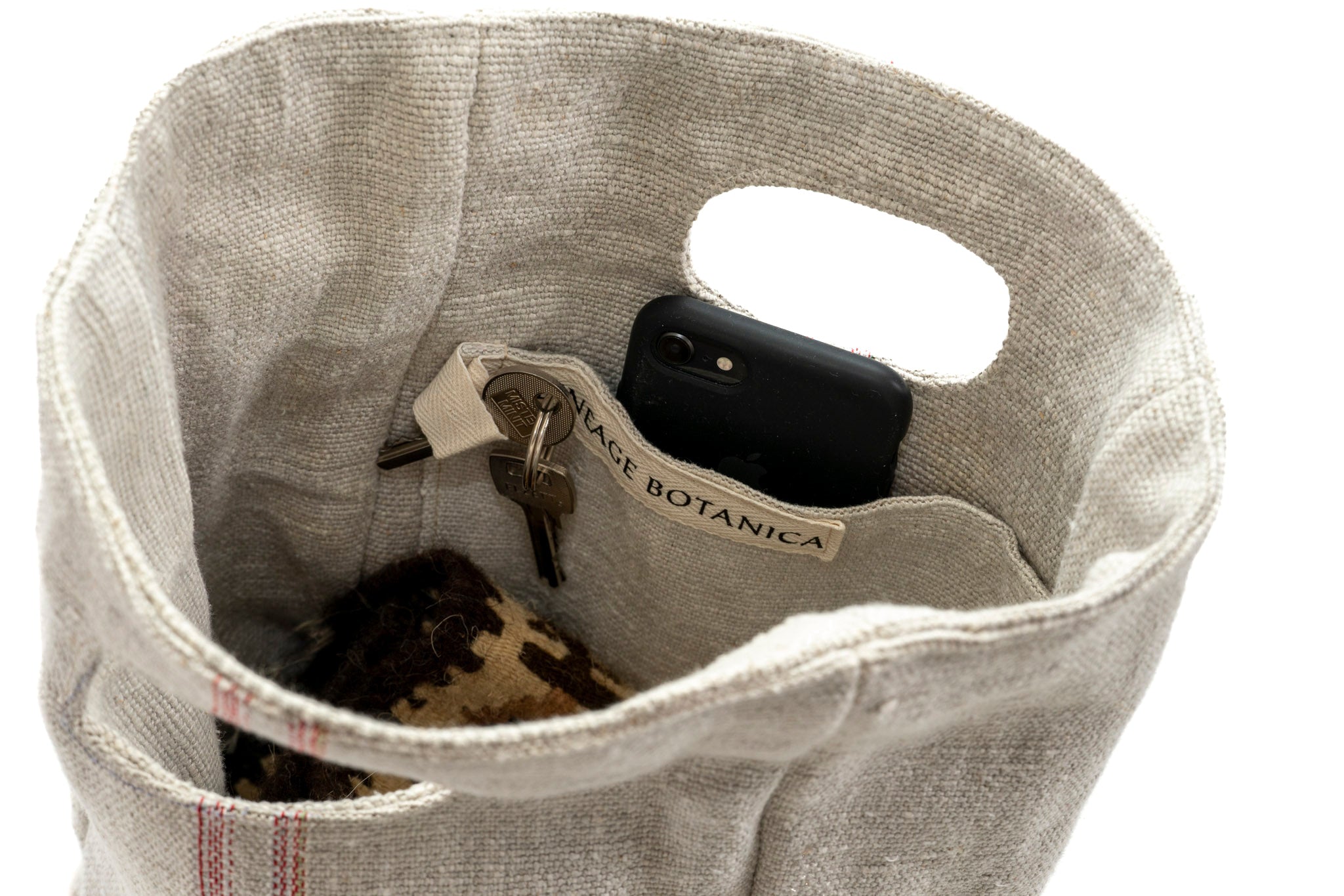 Handwoven carry bag with pockets and built-in handles, made from antique Hungarian hemp.