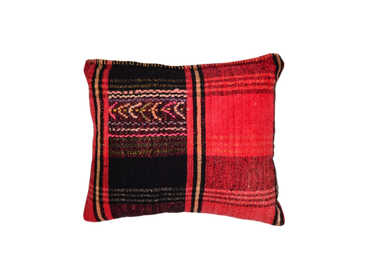 Artifact textile handwoven pillow from Bulgaria with vibrant patterns.