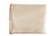 Eco-cotton throw with hand-stitched trim in cinnamon color, folded showcasing luxurious softness.