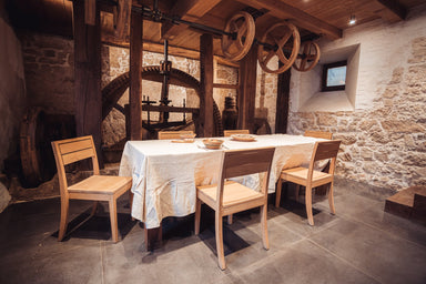 Handwoven Indian cotton table cloth in rustic dining room.