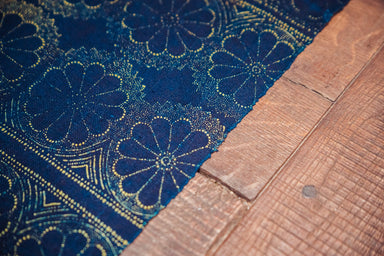 Antique handwoven Hungarian hemp table cloth with indigo wax resist and yellow floral pattern.